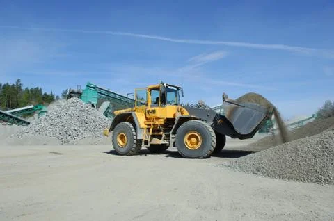 Wheel loader construction machine at work Stock Photos