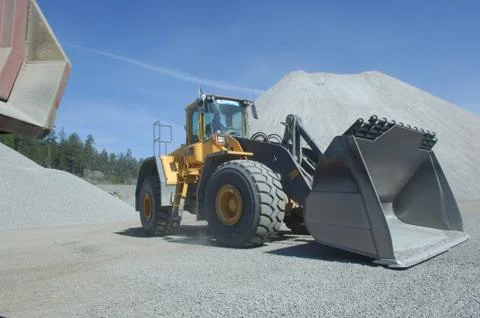 Wheel loader construction machine at work Stock Photos