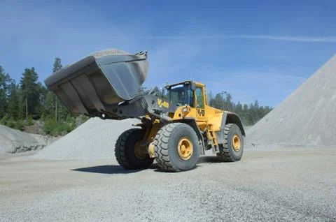 Wheel loader construction machine at work Stock Photos