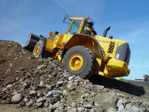 Wheel loader construction machine at work Stock Photos