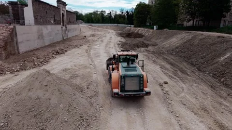 Wheel loader driving on construction site Stock Footage 334548870