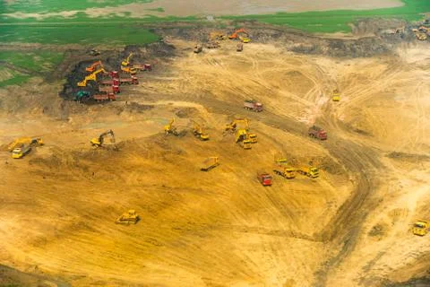 Wheel loader excavator unloading sand, tractors and dump truck inside constru Stock-Fotos