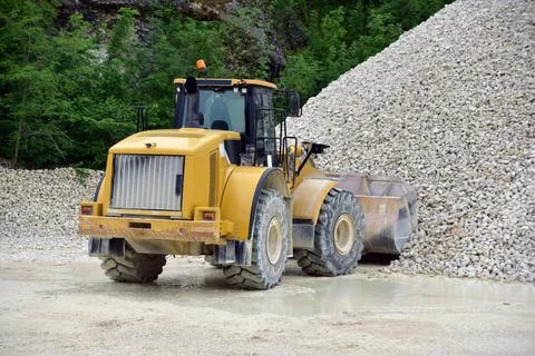 Wheel loader excavator unloading sand Stock Photos