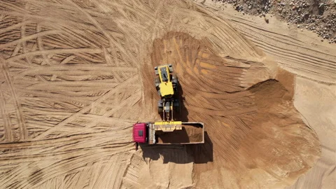 Wheel loader load sand in dump truck in open pit. Heavy machinery in opencast Video stock 191823812