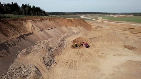 Wheel loader load sand in tipper truck in open pit. Stock Footage 194009830