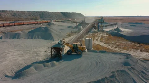 Wheel loader load stone in crusher, works on production of building materials Stock Footage 165060735
