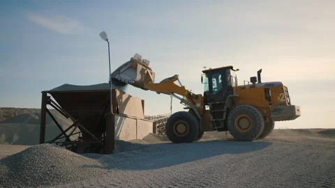 Wheel loader load stone in crusher, works on production of building materials Stock Footage 165297116