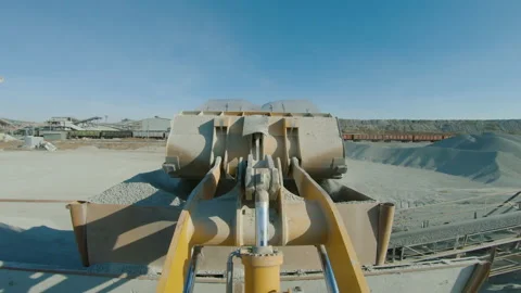 Wheel loader load stone in crusher, works on production of building materials Stock Footage 165387997