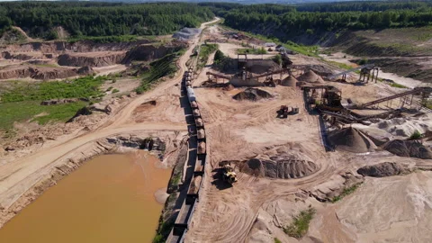 Wheel loader loading sand it to the freight train. Mining work in open pit. 스톡 동영상 156616894