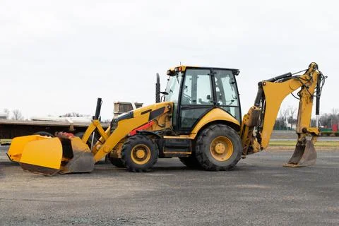 Wheel loader machine on the road Stock Photos