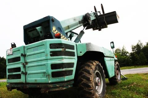 Wheel loader machine unloading rocks in the open-mine of iron ore Stock Photos