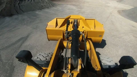 Wheel loader picks up into bucket crushed stone and moves Stock Footage 165761120