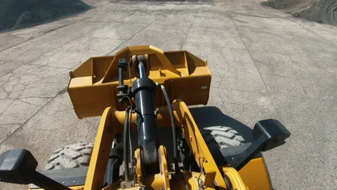 Wheel loader picks up into bucket crushed stone and moves Video stock 173537907