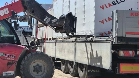 Wheel Loader Unloading Masonry Materials from Truck Budapest Stock-Footage 336333111
