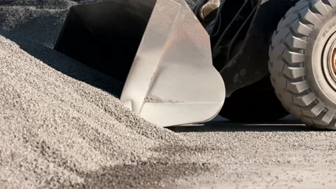 Wheel Loader's Bucket Loading A Scoop Of Gravel In A Tarmac Factory Stock Footage 142008614