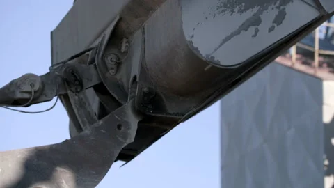 Wheel Loader's Bucket Unloading A Scoop Of Gravel In A Tarmac Factory Stock Footage 141999845