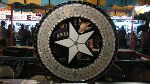 Wheel of luck at a carnival Stock Footage 99571