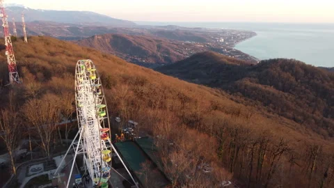 A wheel of observation on Mount Ahun with a view of the city Stock Footage 246641843