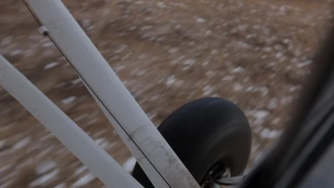 Wheel of Piper Cub at Take Off Stock Footage 106172687
