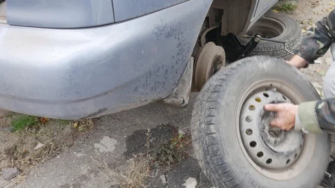 Wheel replacement. Changing Out All Season Summer Tires to Winter Tires Stock Footage 119465856