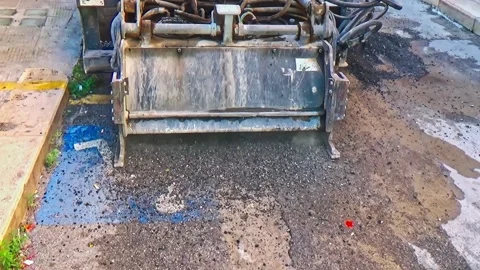 Wheel Saws with cones for drilling rock mounted on mini excavator during the  動画素材 287483418