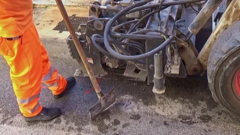 Wheel Saws with cones for drilling rock mounted on mini excavator during the  Stock-Footage 287483423