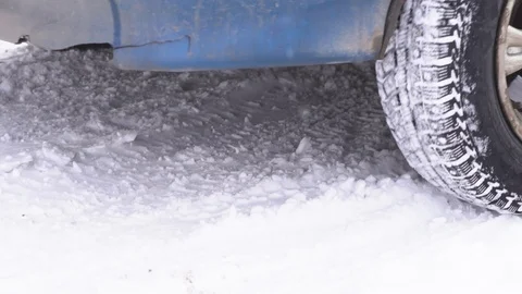 The wheel is slipping in the snow Stock Footage 86346385