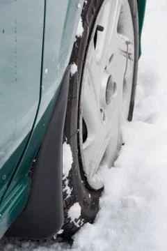 Wheel on snow Stock Photos