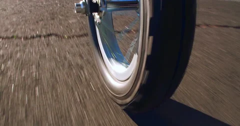 Wheel spinning while driving fast on asphalt road in the park at sunset, 4K Stock Footage 164254734