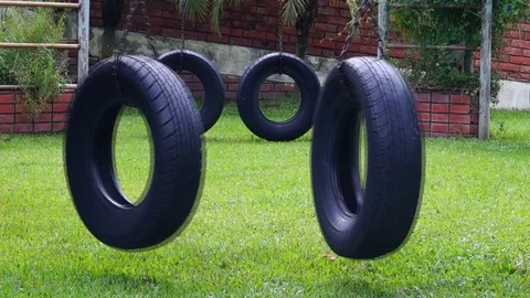 Wheel swing in playground Stock Footage 79307332