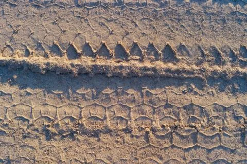 Wheel track in the sand Stock Photos