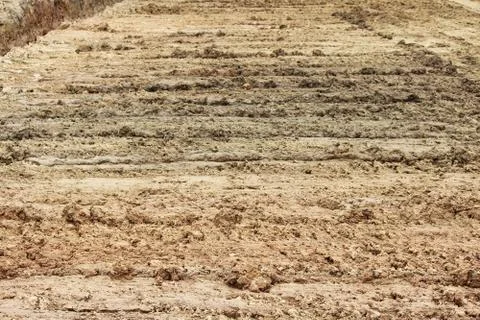 Wheel tracks in the mud, detail footprints bulldozer in the construction Stock Photos