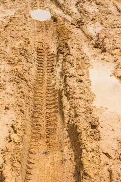 Wheel tracks on rough road Stock Photos