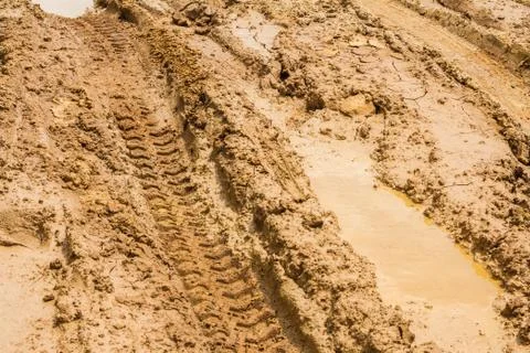 Wheel tracks on rough road Stock Photos