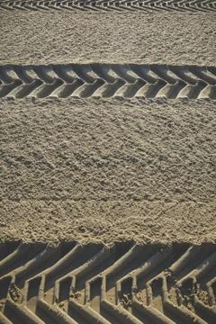 Wheel tracks in the sand Stock Photos