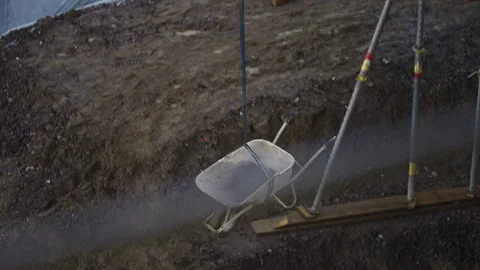 Wheelbarrow Being Lowered into Excavation at Construction Site Stock Footage 336098354