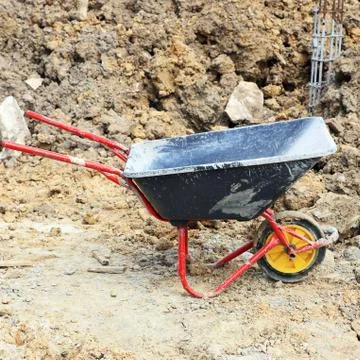 Wheelbarrow in construction site Stock Photos