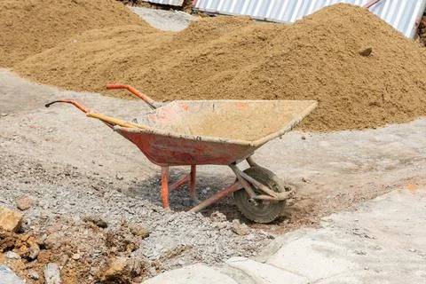 Wheelbarrow in the construction site Stock Photos