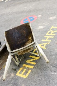 Wheelbarrow with construction waste Stock Photos