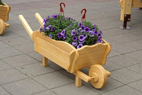 Wheelbarrow garden decor Stock Photos