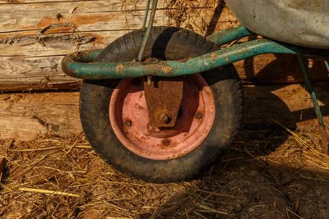 Wheelbarrow rusty wheel close-up Stock Photos