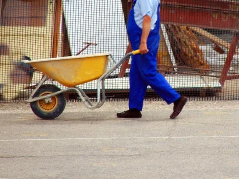 A wheelbarrow worker - construction Fotos Stock