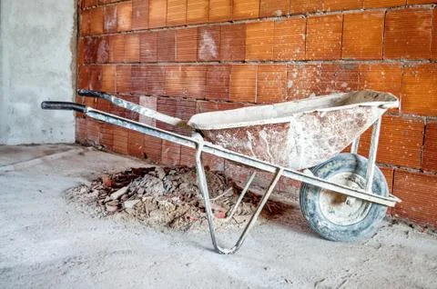 Wheelbarrow in workplace Stock Photos