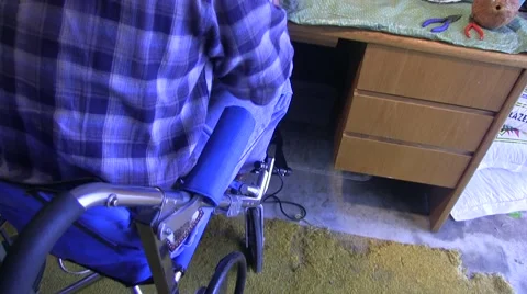 A wheelchair bound man gets ready for work Video stock 45165098