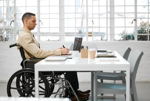 Wheelchair, disabled and handicap business man working, planning and writing Stock Photos