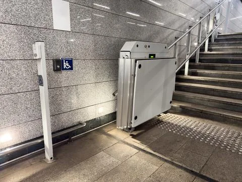 Wheelchair elevator. Platform for wheelchair users. Automatic system for di.. Stock Photos