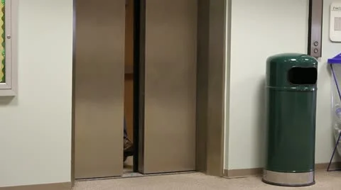 Wheelchair Exiting Elevator Vidéo 12313769