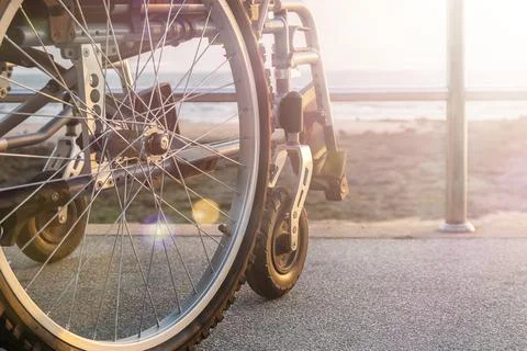 A wheelchair stands on the seafront Stock Photos