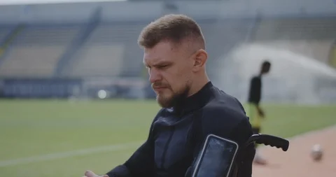 Wheelchaired athlete looking at camera Stock Footage 116766279