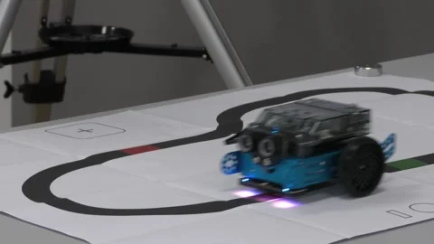 Wheeled robot moving along a line in robotics classroom Stock Footage 315364887